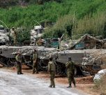 Israeli Soldiers Gather Near Armoured Personnel Carriers (apcs) Near Israel's Border With Lebanon, Northern Israel