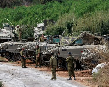 Israeli Soldiers Gather Near Armoured Personnel Carriers (apcs) Near Israel's Border With Lebanon, Northern Israel